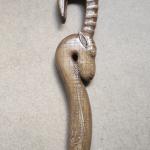 #164 A stick 190 cm high with an goat head and wood carving