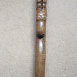 #164 A stick 190 cm high with an goat head and wood carving
