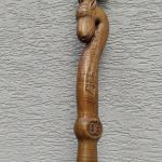 #164 A stick 190 cm high with an goat head and wood carving