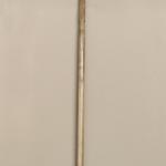 #164 A stick 190 cm high with an goat head and wood carving
