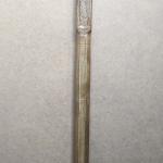 #164 A stick 190 cm high with an goat head and wood carving